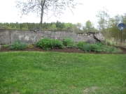 farther to the right of the old milkhouse