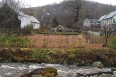 looking across the river at put to bed garden
